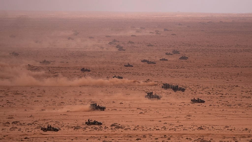 A sombre image of a US soldier in uniform, with a Moroccan landscape in the background, symbolising the tragic loss of a US soldier in the Atlantic Ocean off the coast of Morocco