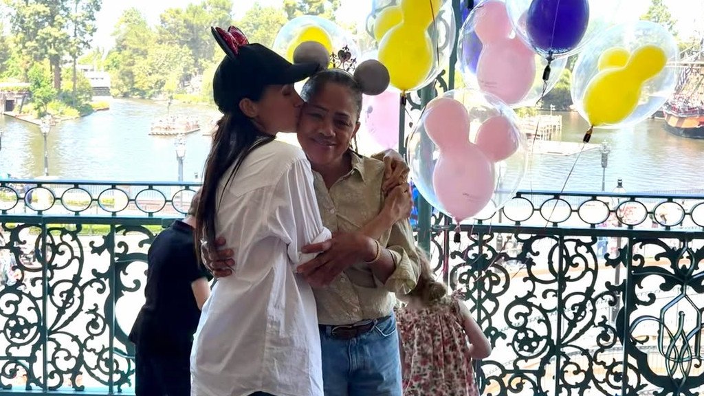 The Duchess of Sussex, Meghan, and her family enjoy a fun-filled day at Disneyland, surrounded by colourful attractions and adoring fans, with the primary keyword being Duchess of Sussex