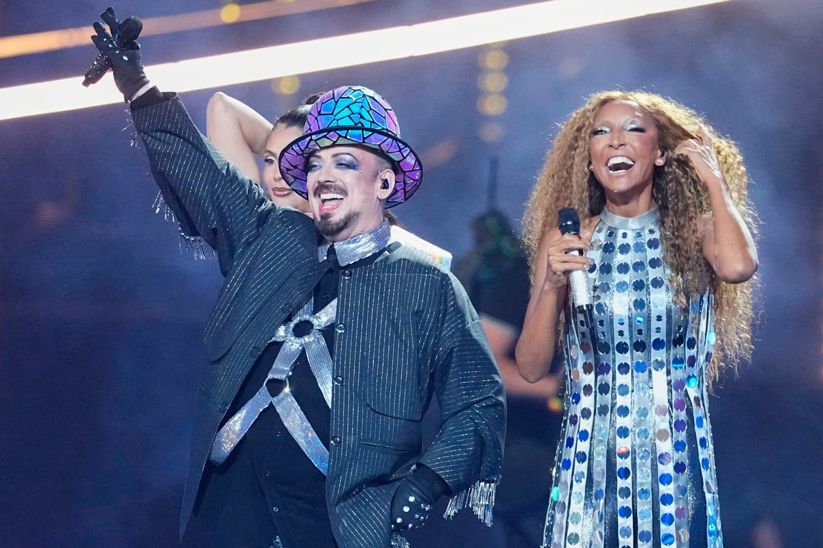 Boy George performing on stage with San Marino at the Eurovision Song Contest, a celebration of music, culture, and entertainment, with a captivating blend of excitement, drama, and spectacle, featuring a range of talented acts and memorable performances, including the iconic lead singer of Culture Club