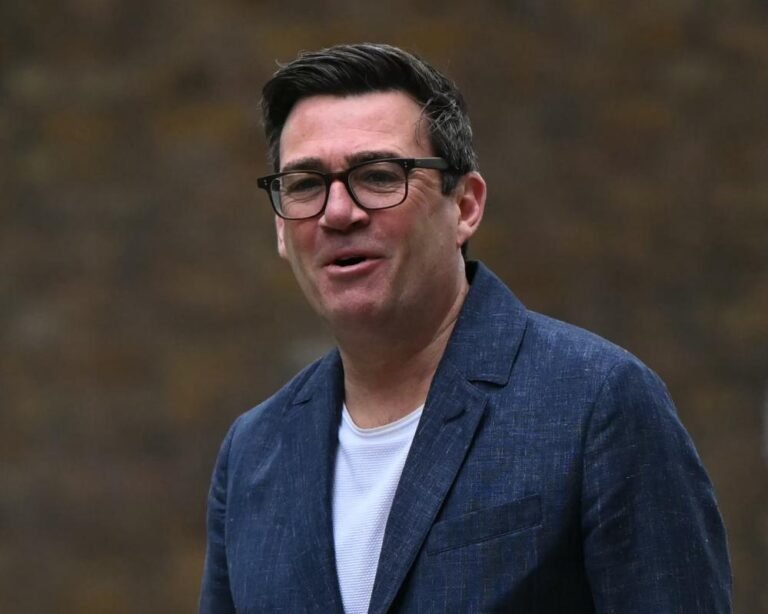 Andy Burnham, a determined figure in British politics, standing in front of the Houses of Parliament, with a resolute expression, embodying his commitment to his cause and his desire to make a positive impact on the future of UK politics