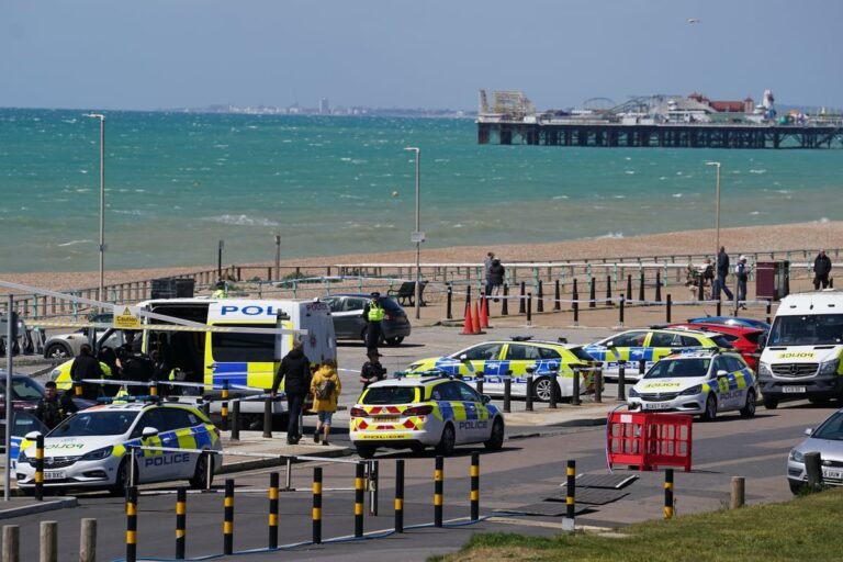 A sombre and reflective image of Brighton beach, with a focus on the sea and the surrounding area, where the bodies of three young women were found, highlighting the tragedy and loss of life, with the primary keyword being Brighton beach tragedy