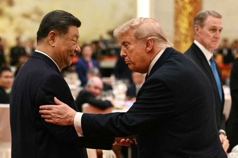 Chinese and American flags waving in the wind, symbolising the complex and multifaceted relationship between the two nations, with a focus on diplomatic relations and global stability