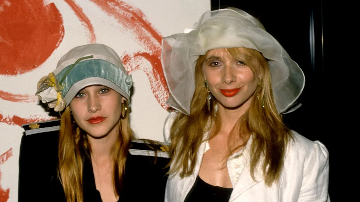 Iconic 80s star siblings pose together on the red carpet, smiling and waving at fans. The siblings look stylish and ageless in their colour-coordinated outfits, sparking excitement among fans who have been waiting for their reunion. The image captures the glamour and excitement of the event, with the siblings' behaviour and charisma on full display