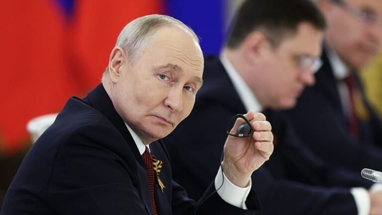 Vladimir Putin stands at a podium, looking out at a crowd of world leaders, as 36 countries join a special tribunal to prosecute him for war crimes and human rights abuses, in a move that marks a significant shift in global politics and a new era of accountability