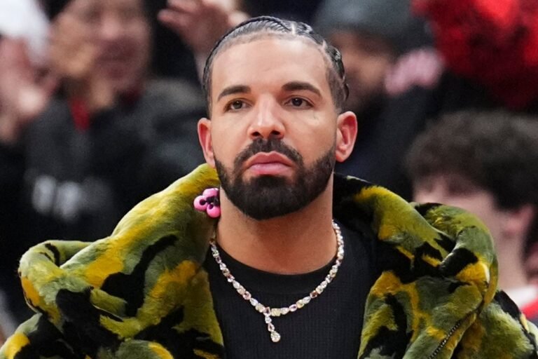 Drake, the Canadian rapper, posing with a sombre expression, highlighting his self-deprecating behaviour and introspective personality, with a cityscape in the background, symbolising his rise to fame and success in the music industry