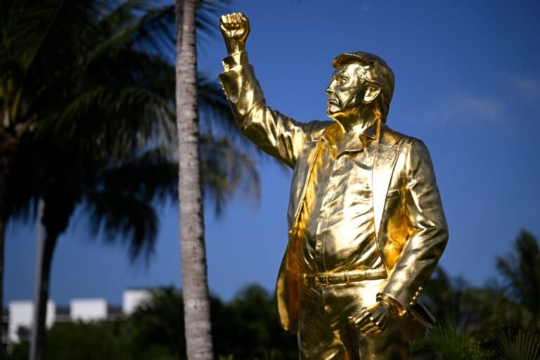 A giant gold statue of Donald Trump at his golf course, sparking controversy and debate among members and non-members alike, with a mix of admiration and criticism, as people analyse its significance and impact on the golf course's atmosphere, with the primary keyword being Trump gold statue