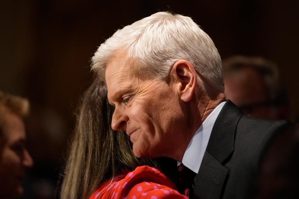 A photo of Bill Cassidy and Donald Trump, with a caption describing the dramatic turn of events in the primary election, highlighting the significant role of Trump's intervention in Cassidy's defeat, and the impact on the Republican Party's political landscape and behaviour