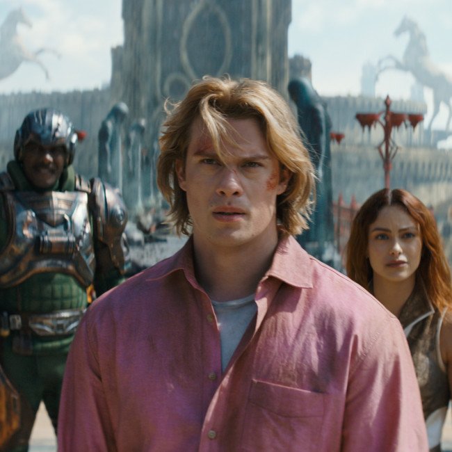 He-Man and Skeletor stand facing each other, their colourful costumes and dramatic poses a testament to the epic struggle between good and evil in the Masters of the Universe franchise, with the powerful warrior He-Man wielding his mighty sword and the villainous Skeletor casting a spell, set against a backdrop of the magical world of Eternia