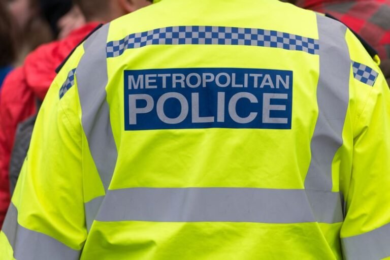 A teenager being rushed to hospital after a stabbing outside a London Underground station, with police and emergency services at the scene, highlighting the issue of knife crime in London