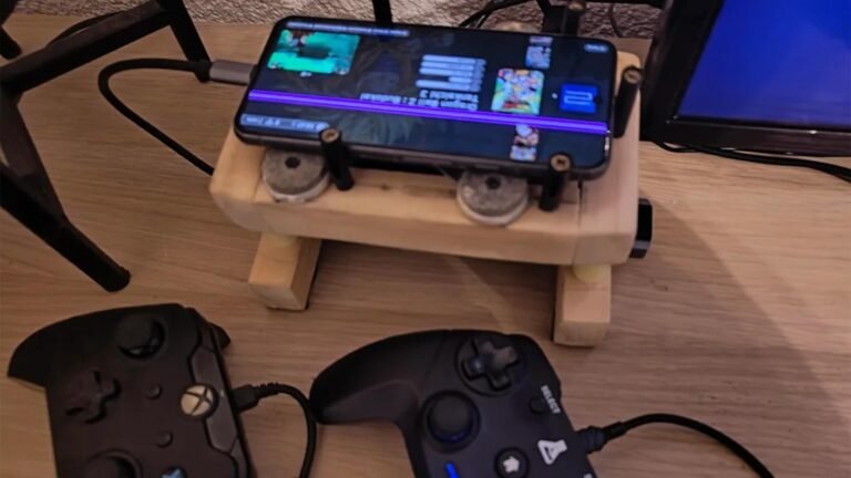 A damaged Pixel 8 smartphone converted into a playable gaming console with multiple controllers and active cooling, featuring a unique DIY design and sustainable technology, perfect for gaming enthusiasts in the UK