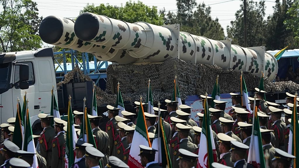 Iranian military personnel and equipment, with a focus on the country's military preparedness and readiness for conflict, highlighting the potential for a devastating war in the region