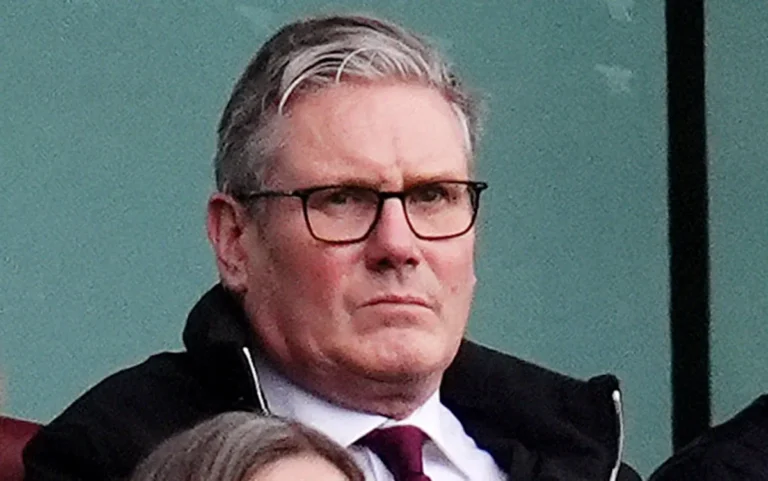Labour Party leader Keir Starmer stands at a podium, looking determined as he addresses the party's crisis, with a backdrop of party members and supporters, all searching for a way forward amidst the turmoil
