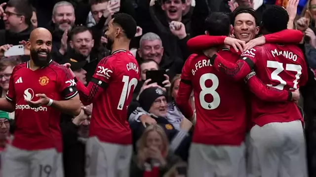 Manchester United players celebrating their latest victory, demonstrating their team spirit and unity, with a strong sense of connection and camaraderie, as they stand together in their colourful jerseys, filled with passion and energy, as they analyse their opponents and develop effective strategies