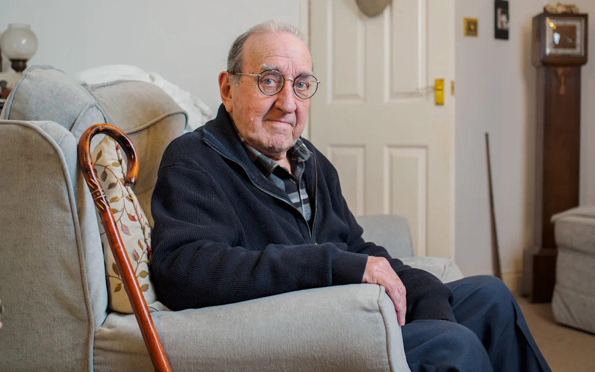 A group of residents gathered outside the local council building, holding signs that read 'Boycott Council Tax' and 'Democracy Matters', with a large banner in the background reading 'We Want Our Right to Vote', highlighting the growing movement to protest the cancellation of local elections and the importance of democratic participation