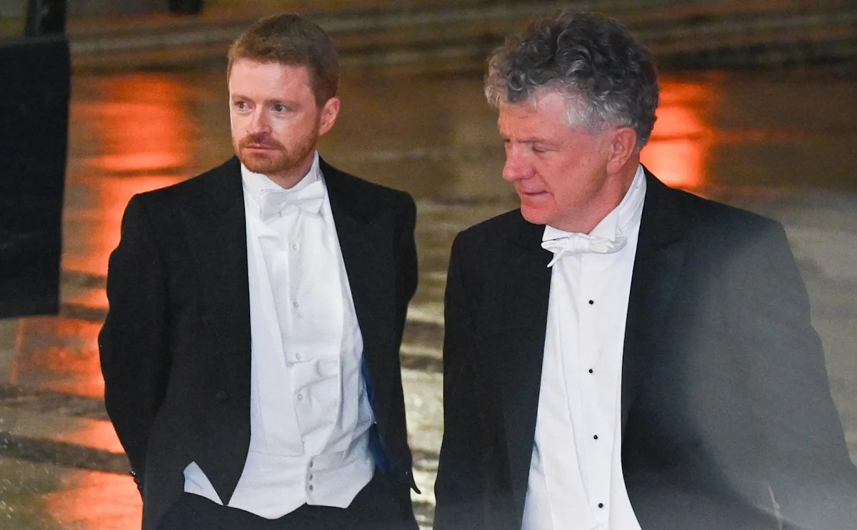 McSweeney and Powell in a heated discussion, with a complex and unclear situation unfolding in the background, as the industry continues to analyse the reasons behind the exit