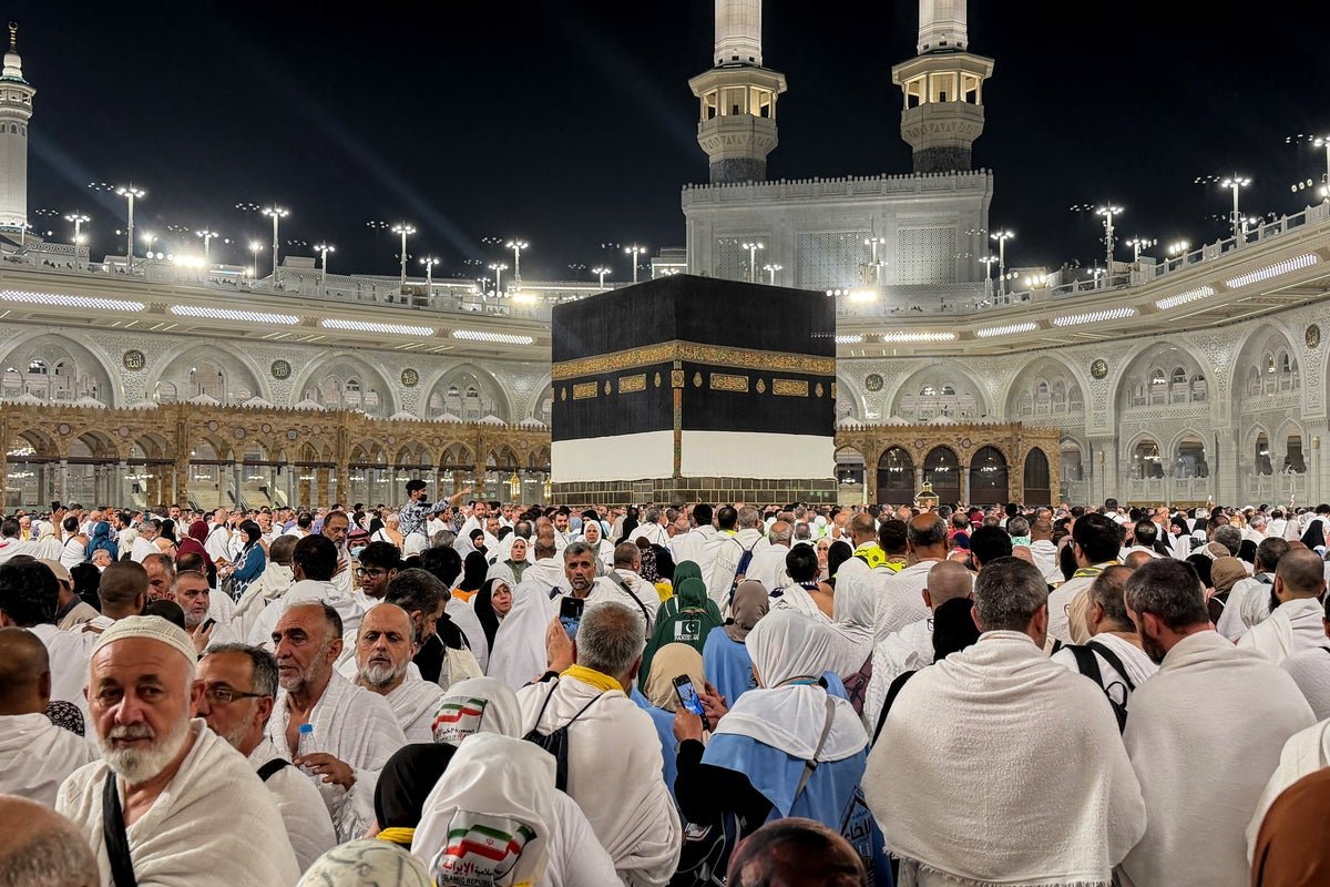 Aerial view of the Hajj pilgrimage in Mecca, Saudi Arabia, with thousands of devotees gathered around the Kaaba, highlighting the significance of this religious event in the Islamic calendar and its potential impact on international relations and geopolitics