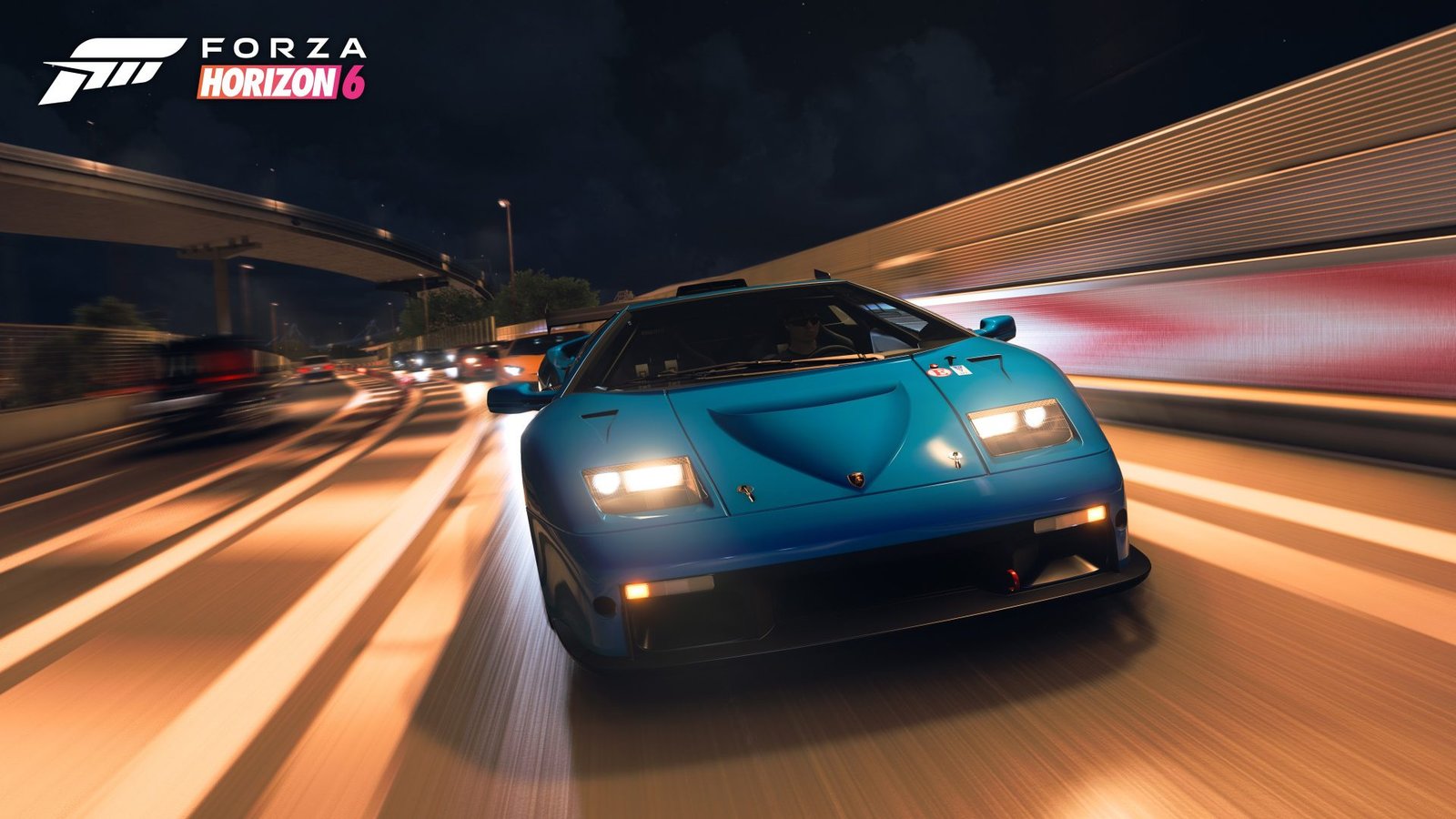 Forza Horizon 6 racing game screenshot, featuring a car speeding through a Japanese city, with a stunning mountain landscape in the background, showcasing the game's colourful and vibrant graphics