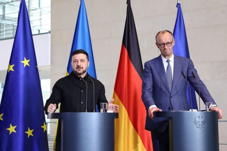 Ukrainian President Volodymyr Zelenskiy speaking at a press conference, discussing the EU membership proposal and its implications for Ukraine's sovereignty and territorial integrity, with a focus on the country's struggle for independence and self-determination