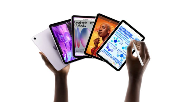 A person holding a compact tablet with a colourful background, representing the UK's tablet market and the new competitor to the iPad mini 7
