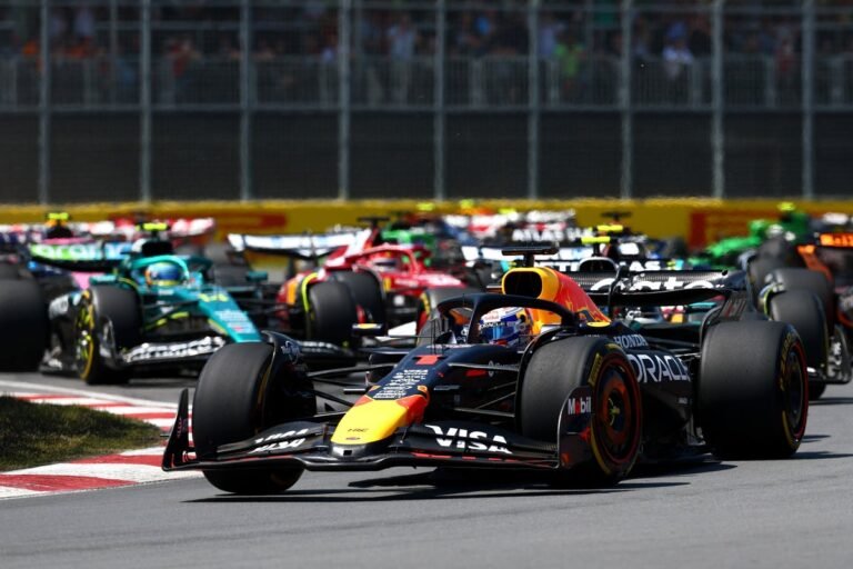 Formula 1 cars racing on the Canadian Grand Prix track, with a crowd of fans cheering in the background. The image captures the colour and excitement of the event, with a focus on the F1 live streams available online.