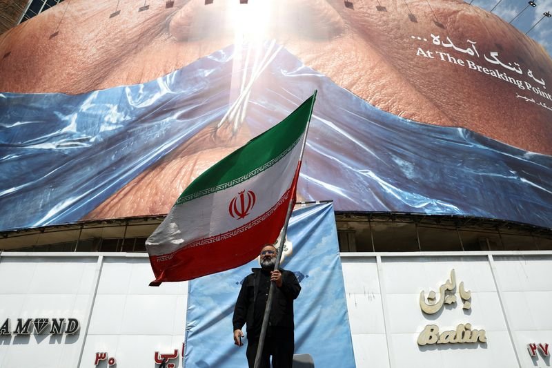 Iran and US flags waving in the wind, symbolising a potential peace deal between the two nations, with a focus on the primary keyword of Iran US relations