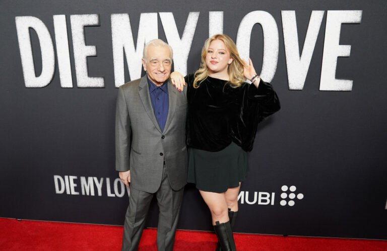 Francesca Scorsese, daughter of Martin Scorsese, smiles confidently as she walks the red carpet, surrounded by paparazzi, highlighting her strength and resilience in the face of online trolling and criticism, as a 'nepo baby' in the film industry