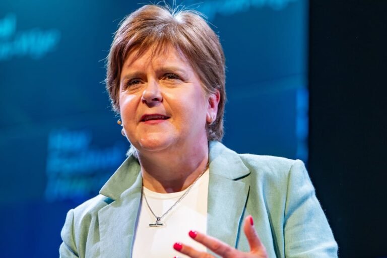 Nicola Sturgeon, the former First Minister of Scotland, pictured outside a London building, amidst controversy surrounding her husband's conviction, as she defends her record and navigates a new chapter in her life, with a mix of curiosity and scrutiny from the public and the media, in the heart of the UK's capital city, with a subtle blend of colour and emotion, as she embarks on a new journey, with a determined look on her face, and a sense of purpose in her eyes.
