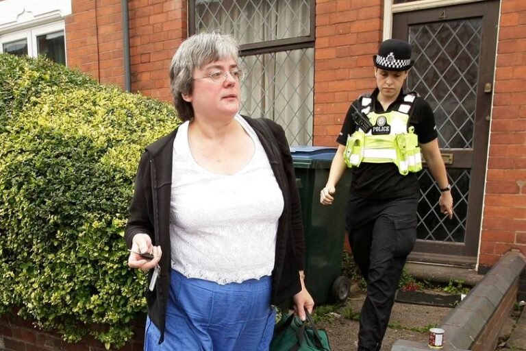 A woman holding a cat, with a bin in the background, symbolising the incident that sparked widespread outrage and raised awareness about animal welfare, with a focus on the importance of treating all living creatures with kindness and respect, in the Midlands region of the UK