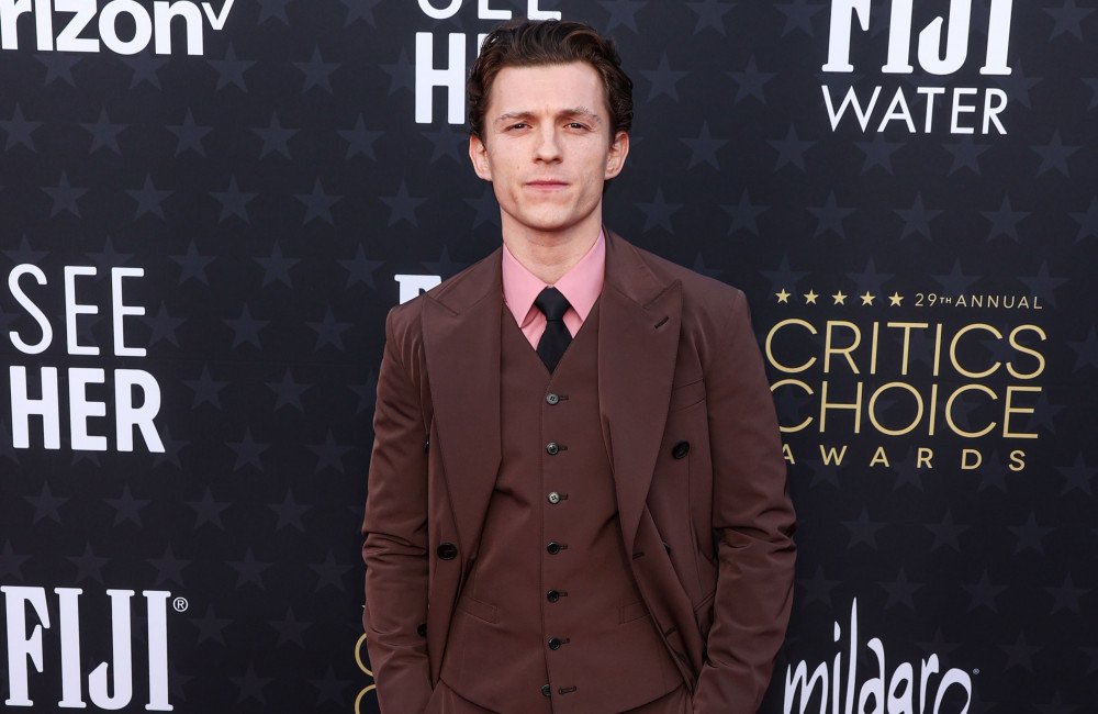 Tom Holland posing for a photo, looking sophisticated and responsible, with a hint of his former party animal persona still visible in his eyes, reflecting his journey towards becoming a more disciplined individual, with a focus on his career as Spider-Man