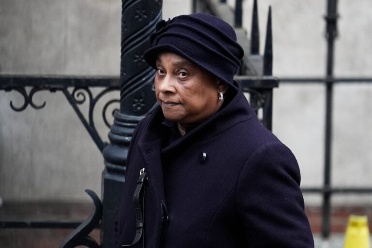 Doreen Lawrence, mother of Stephen Lawrence, speaking out against racial violence and discrimination, with a determined look on her face, highlighting the importance of justice and equality in the UK