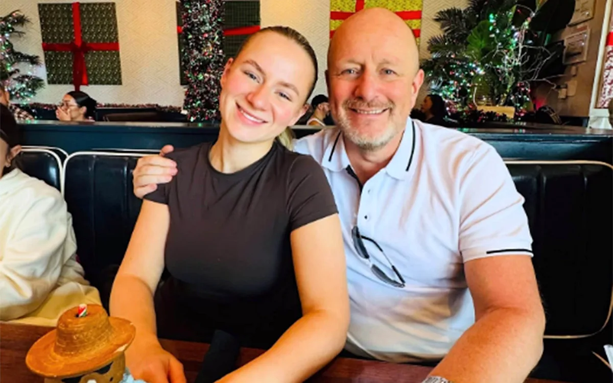 A father and daughter in a happy moment, with a gun in the background, highlighting the importance of responsible gun ownership and behaviour, with a focus on gun safety and accident prevention