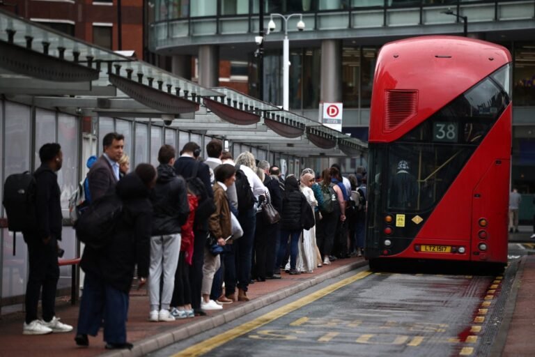 A crowded tube station during a strike, with commuters waiting for alternative transport, highlighting the need for employee rights and flexible working arrangements during tube strikes