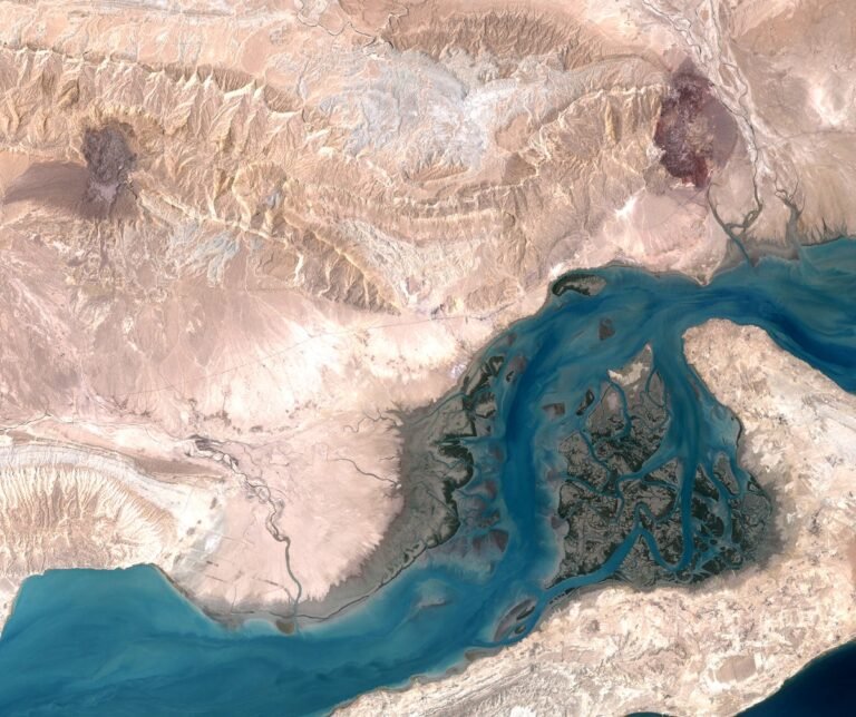 Aerial view of Qeshm Island, showcasing its unique geography and strategic location in the Middle East, with a focus on its underground missile city and military capabilities