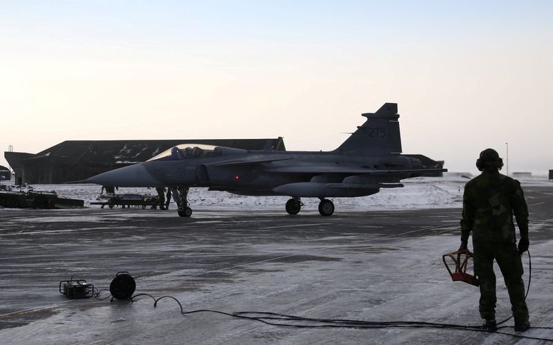 A Gripen fighter jet in flight, with a landscape of Ukraine in the background, highlighting the aircraft's advanced technology and manoeuvrability in the country's aerial conflict with Russia