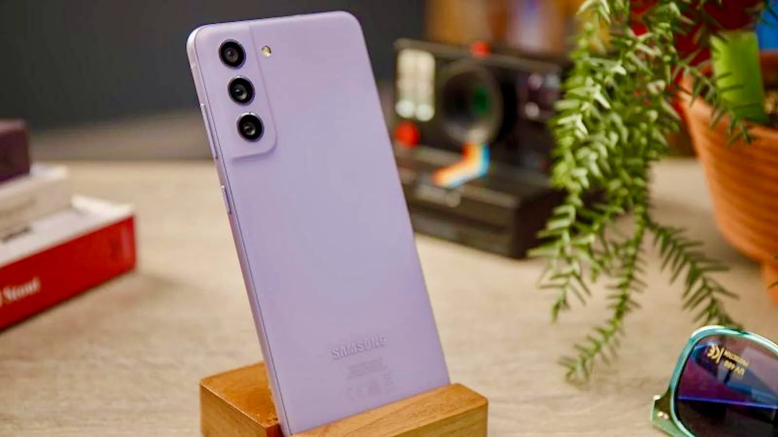 A person holding a compact phone, with a cityscape in the background, highlighting the benefits of small phones in everyday life, with the primary keyword compact phones