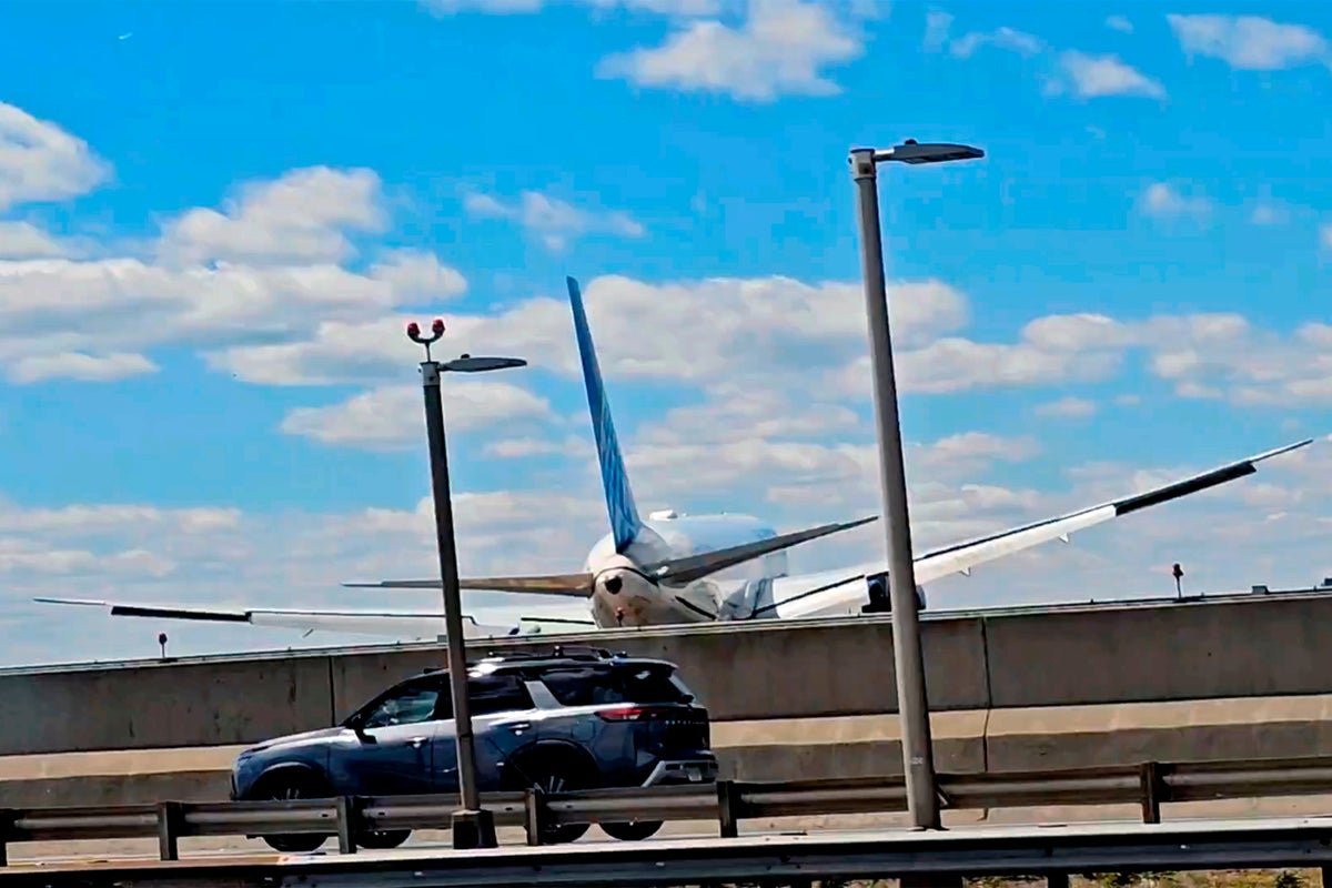 A plane approaching the runway at New Jersey Airport, with a pole in the foreground, highlighting the importance of air safety and the need for robust safety protocols to prevent incidents like the recent flight incident