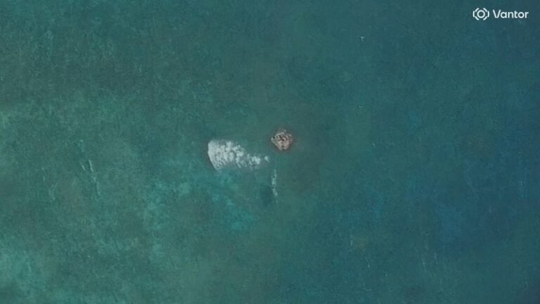 A satellite image of the disputed South China Sea atoll, showing a suspected structure, with the colour of the water appearing calm, but with many complex issues at play, including the role of China in the region, and the importance of monitoring the area, with the primary keyword being South China Sea