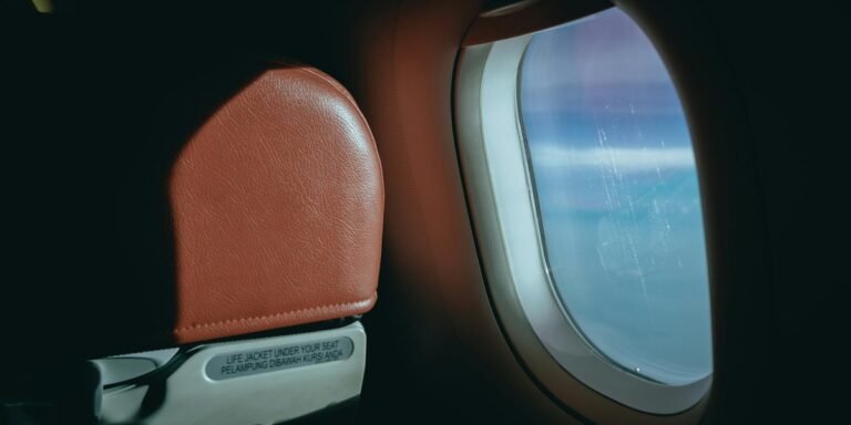 A plane taking off with open window blinds, highlighting the importance of situational awareness and aviation safety, with a clear view of the surrounding environment