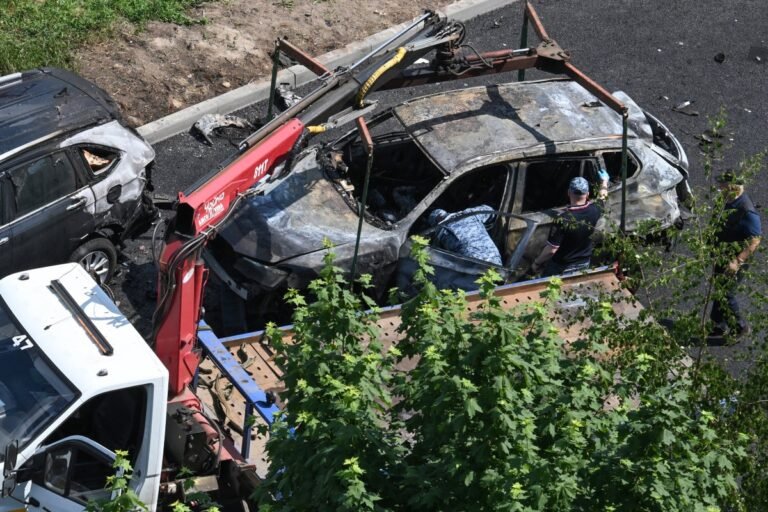 A damaged car in Moscow after a car bombing, with a primary keyword of car bombing in Moscow, the incident has raised concerns about the safety and security of high-ranking officials in Russia