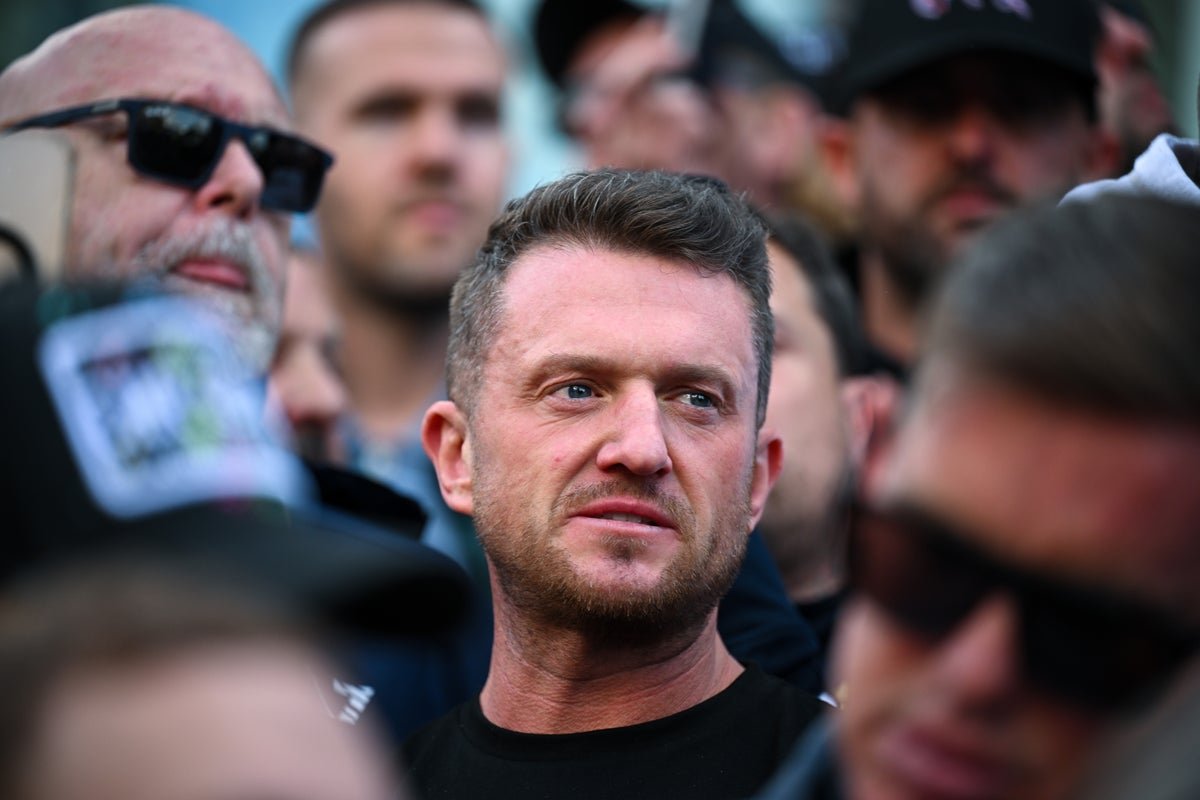 Tommy Robinson meeting with Elon Musk's father in Moscow, a controversial visit that has sparked debate about Russia and diplomacy, with many questioning his intentions and behaviour, in the context of international relations and geopolitical tensions