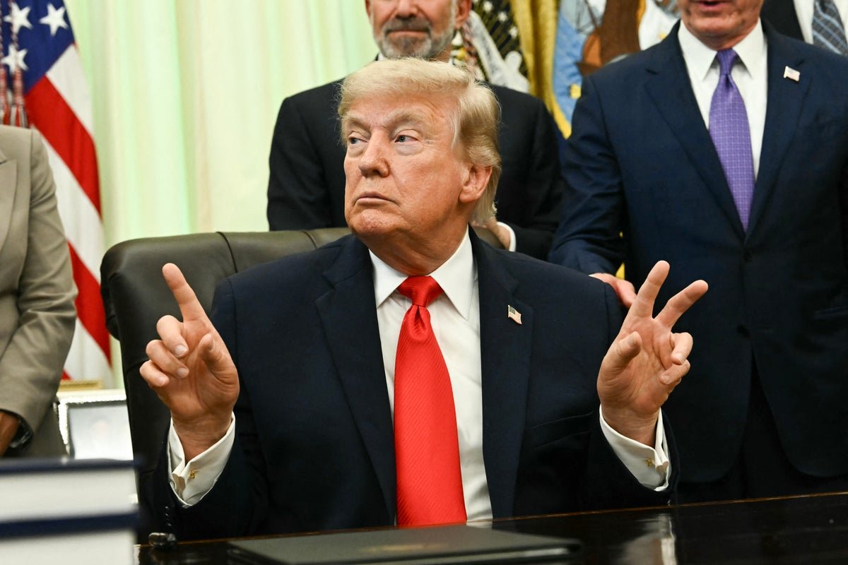 A photo of Trump signing a seafood order, with a caption that reads 'Trump sparks debate on political correctness with fisherman remark, highlighting the importance of language and behaviour in shaping our society'