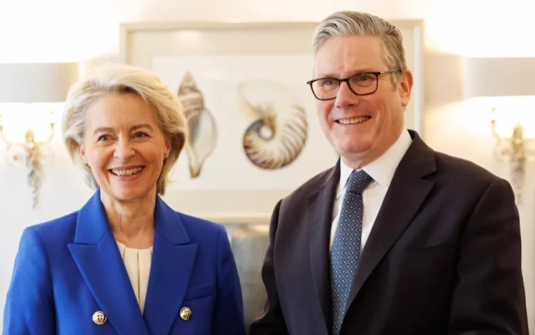 The UK and EU flags waving together, symbolising the adoption of EU net zero rules, promoting sustainable development and reducing carbon emissions, a significant step towards a greener future