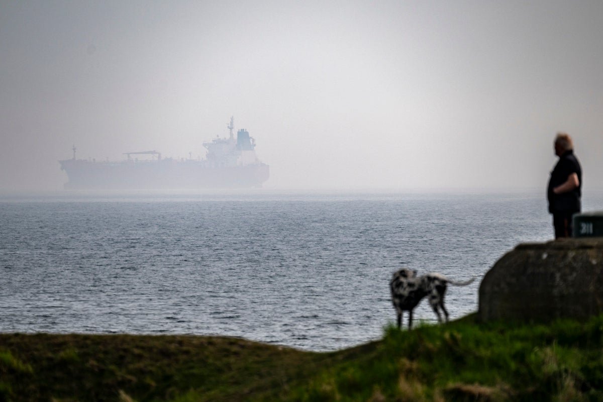 A photo of a Russian tanker being boarded by UK armed forces in the English Channel, with the UK flag flying high, symbolising the country's commitment to maritime security and its efforts to disrupt Russian shadow fleet activity