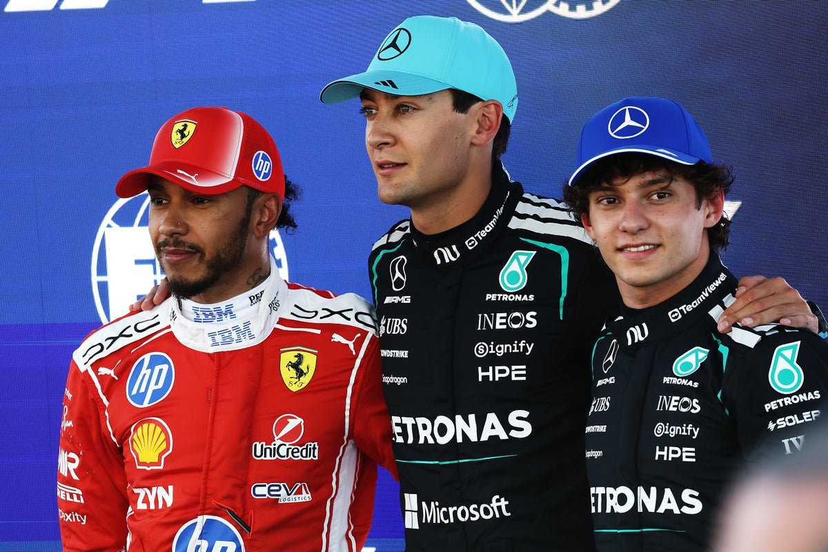 Lewis Hamilton in his Formula 1 car, racing at high speed on the Barcelona track, with a crowd of spectators in the background, watching the action unfold with great interest and anticipation, as the primary keyword phrase F1 standings is on display