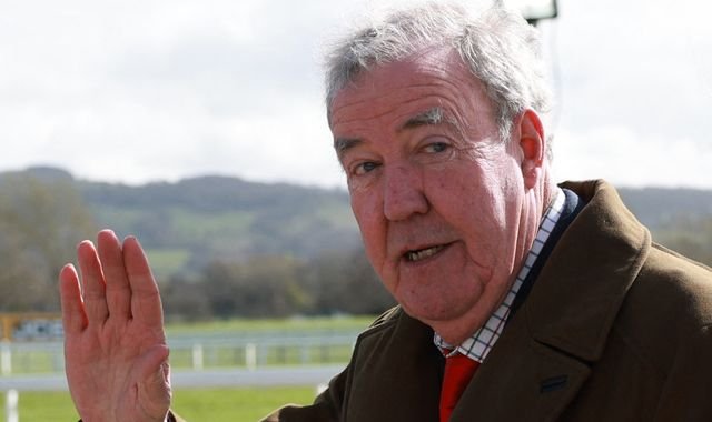 Jeremy Clarkson smiling and standing in front of a car, with a caption that reads 'Jeremy Clarkson's brave cancer battle'