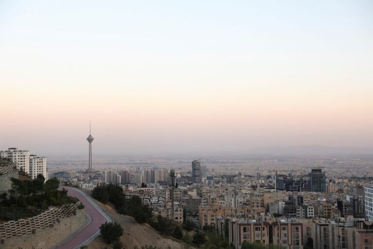 Iran deal signing ceremony, with representatives from various countries gathered around a table, shaking hands and smiling, symbolising a new era of economic cooperation and diplomacy, with a focus on international trade and development