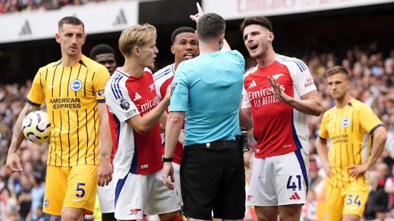 Arsenal players in action against Brighton