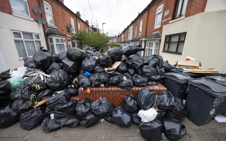 Labour councillors in a meeting, discussing financial management and bin strike, with a focus on transparency and accountability, and a primary keyword of financial mismanagement