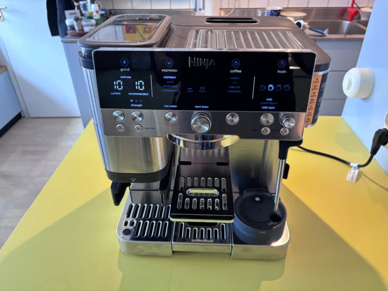 The Ninja Luxe Café Premier coffee machine, featuring a sleek silver design and advanced controls, is capable of producing high-quality coffee with its semi-automatic brewing process and customisation options, including a built-in milk frother.