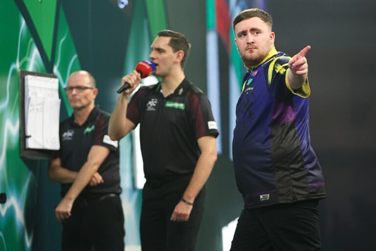 Luke Littler in action at the darts championship